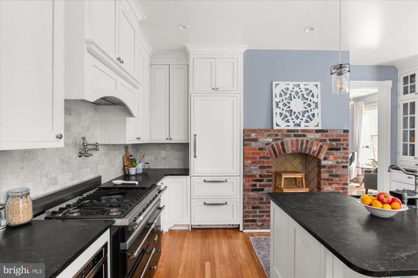 Fireplace, Interior, Kitchen, Pendant Lights, Recessed Lighting, Stainless Steel Appliances, Stone Walls, Wood Texture Flooring
