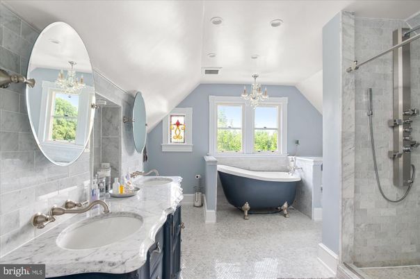 Bathroom, Chandelier, Dual Sink Vanities, Free Standing Baths, Glass Shower, Interior, Marble, Marble Walls, Recessed Lighting