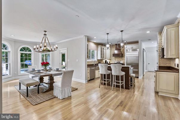 Chandelier, Dining room, Interior, Kitchen, Pendant Lights, Recessed Lighting, Stainless Steel Appliances, Wood Texture Flooring