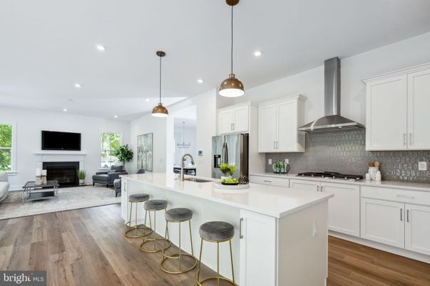 Fireplace, Interior, Kitchen, Living room, Pendant Lights, Recessed Lighting, Stainless Steel Appliances, Wood Texture Flooring
