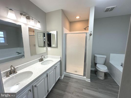 Bathroom, Dual Sink Vanities, Glass Shower, Interior, Recessed Lighting, Wood Texture Flooring