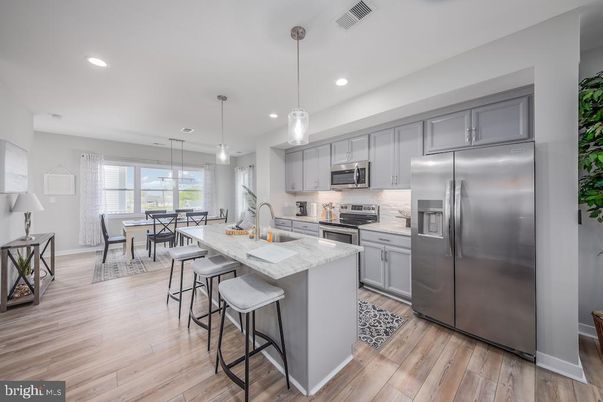 Dining room, Interior, Kitchen, Pendant Lights, Recessed Lighting, Stainless Steel Appliances, Wood Texture Flooring