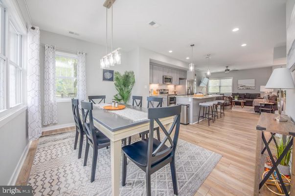 Dining room, Interior, Kitchen, Living room, Pendant Lights, Recessed Lighting, Stainless Steel Appliances, Wood Texture Flooring
