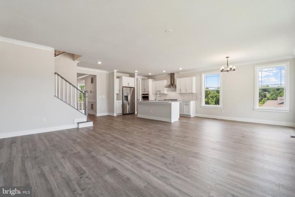 Chandelier, Empty room, Interior, Kitchen, Recessed Lighting, Stainless Steel Appliances, Wood Texture Flooring