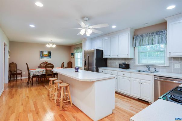 Chandelier, Dining room, Interior, Kitchen, Recessed Lighting, Stainless Steel Appliances, Wood Texture Flooring