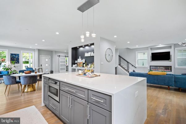 Dining room, Fireplace, Interior, Kitchen, Living room, Pendant Lights, Recessed Lighting, Wood Texture Flooring