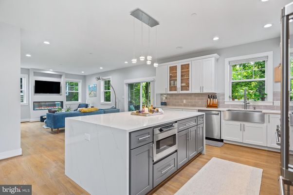 Fireplace, Interior, Kitchen, Living room, Pendant Lights, Recessed Lighting, Stainless Steel Appliances, Wood Texture Flooring