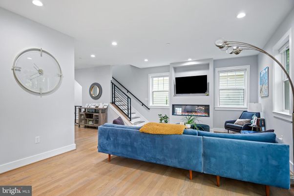Dining room, Fireplace, Interior, Living room, Piano, Recessed Lighting, Wood Texture Flooring