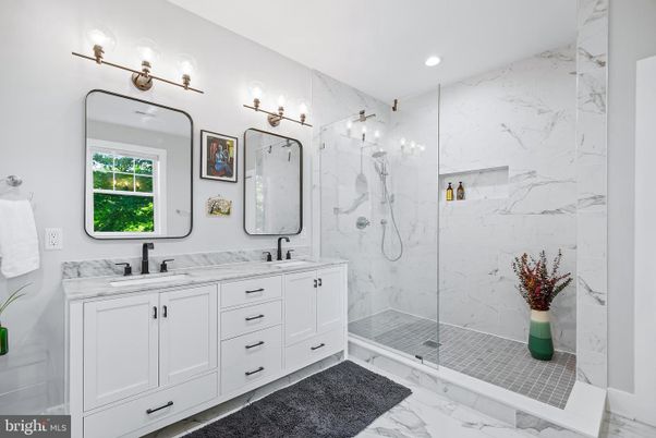 Bathroom, Dual Sink Vanities, Glass Shower, Interior, Marble, Marble Walls, Recessed Lighting