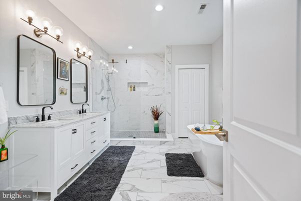 Bathroom, Dual Sink Vanities, Glass Shower, Interior, Marble, Marble Walls, Recessed Lighting