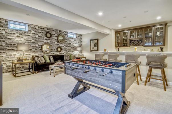 Fireplace, Game Room, Interior, Recessed Lighting, Stone Walls