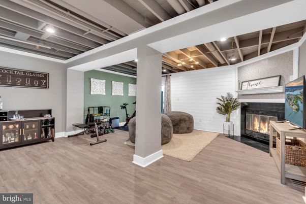 Fireplace, Fitness Equipment, Interior, Recessed Lighting, Wood Texture Flooring