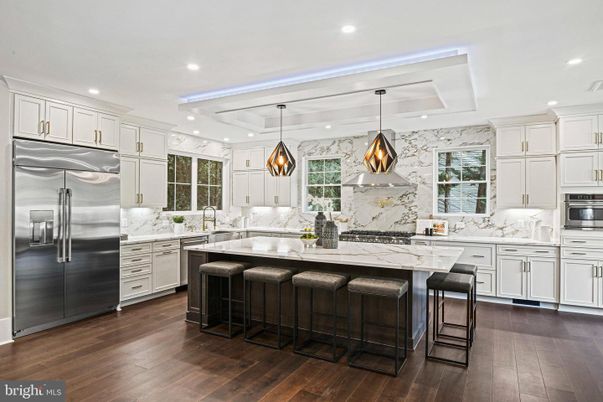 Interior, Kitchen, Marble Walls, Pendant Lights, Recessed Lighting, Stainless Steel Appliances, Wood Texture Flooring