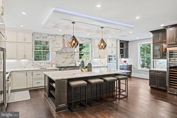Interior, Kitchen, Marble Walls, Pendant Lights, Recessed Lighting, Stainless Steel Appliances, Wood Texture Flooring