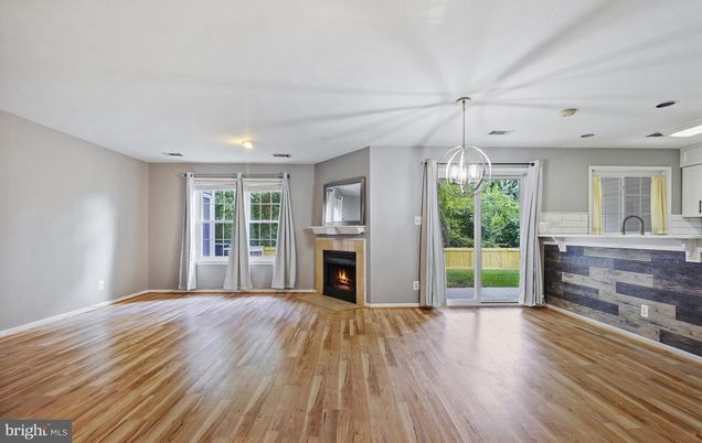 Empty room, Fireplace, Interior, Pendant Lights, Recessed Lighting, Wood Texture Flooring