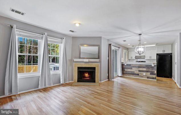 Empty room, Fireplace, Interior, Kitchen, Pendant Lights, Recessed Lighting, Wood Texture Flooring