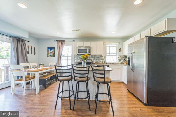 Dining room, Interior, Kitchen, Recessed Lighting, Stainless Steel Appliances, Wood Texture Flooring