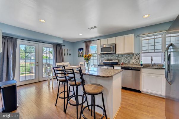 Dining room, Interior, Kitchen, Recessed Lighting, Stainless Steel Appliances, Wood Texture Flooring