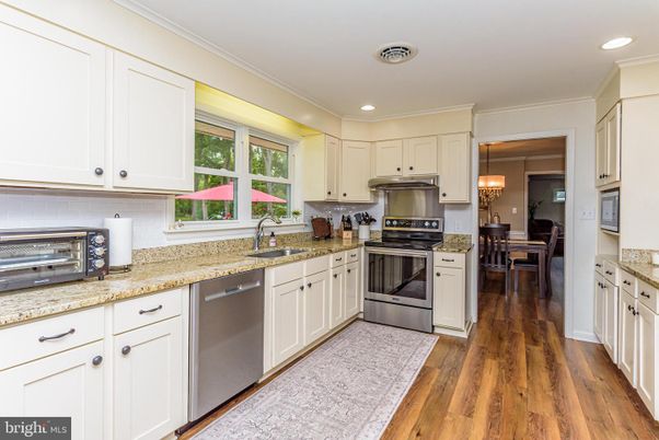 Dining room, Interior, Kitchen, Recessed Lighting, Stainless Steel Appliances, Wood Texture Flooring