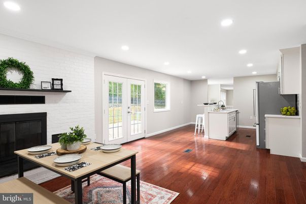 Dining room, Fireplace, Interior, Kitchen, Recessed Lighting, Stone Walls, Wood Texture Flooring
