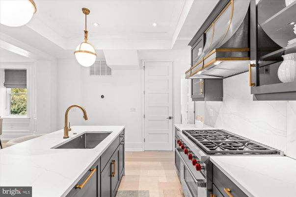 Interior, Kitchen, Marble Walls, Pendant Lights, Recessed Lighting, Stainless Steel Appliances