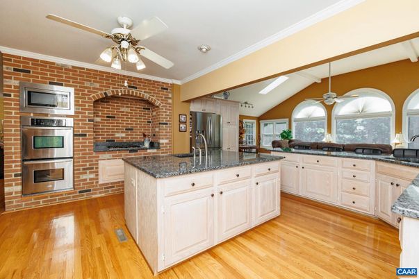Interior, Kitchen, Recessed Lighting, Stainless Steel Appliances, Stone Walls, Wood Texture Flooring