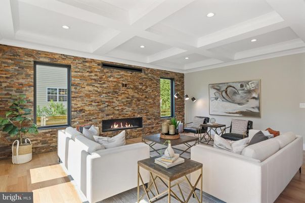 Fireplace, Interior, Living room, Recessed Lighting, Stone Walls, Wood Texture Flooring