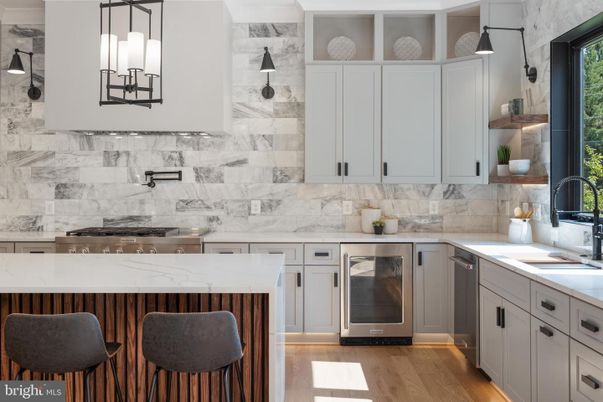 Interior, Kitchen, Marble Walls, Pendant Lights, Stainless Steel Appliances, Wood Texture Flooring