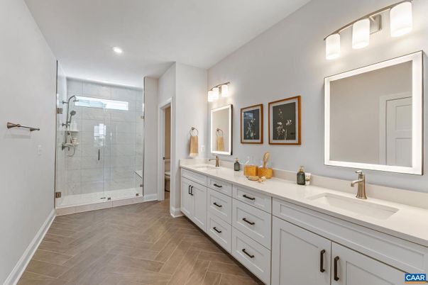 Bathroom, Dual Sink Vanities, Glass Shower, Interior, Recessed Lighting, Wood Texture Flooring