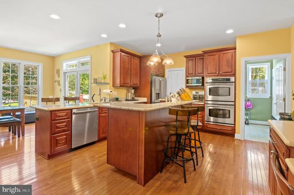 Dining room, Interior, Kitchen, Pendant Lights, Recessed Lighting, Stainless Steel Appliances, Wood Texture Flooring