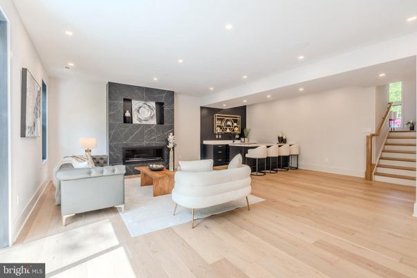 Fireplace, Interior, Living room, Marble Walls, Recessed Lighting, Wood Texture Flooring