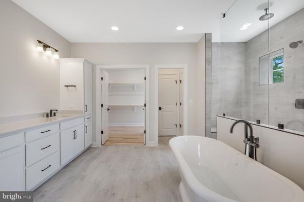 Bathroom, Dual Sink Vanities, Free Standing Baths, Interior, Recessed Lighting, Wood Texture Flooring