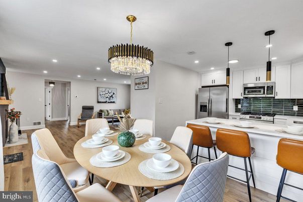 Chandelier, Dining room, Interior, Kitchen, Pendant Lights, Recessed Lighting, Stainless Steel Appliances, Wood Texture Flooring