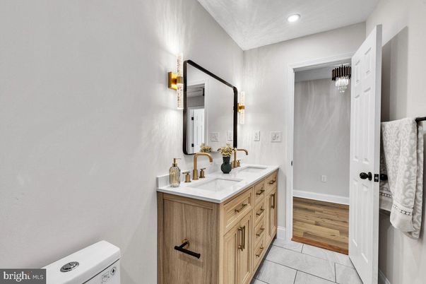 Bathroom, Dual Sink Vanities, Interior, Recessed Lighting, Wood Texture Flooring