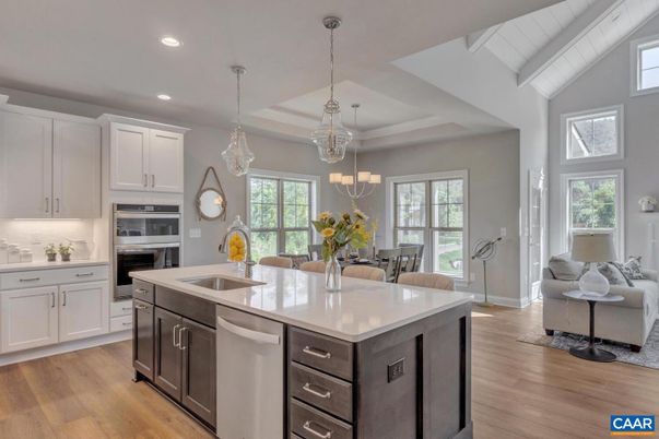 Chandelier, Dining room, Interior, Kitchen, Living room, Pendant Lights, Recessed Lighting, Stainless Steel Appliances, Wood Texture Flooring