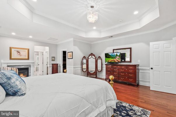 Bedroom, Chandelier, Fireplace, Interior, Recessed Lighting, Wood Texture Flooring