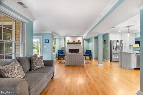 Fireplace, Interior, Kitchen, Living room, Pendant Lights, Recessed Lighting, Stainless Steel Appliances, Wood Texture Flooring