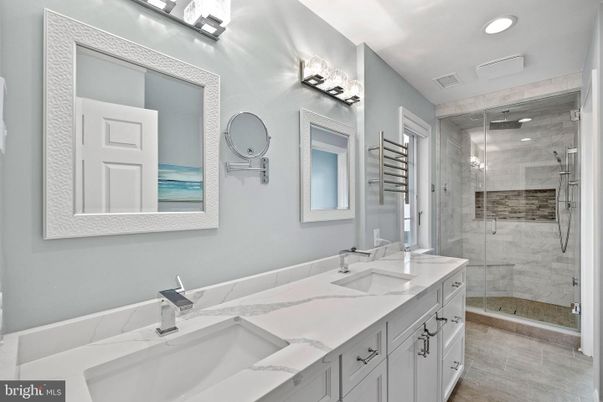 Bathroom, Dual Sink Vanities, Glass Shower, Interior, Marble Walls, Recessed Lighting