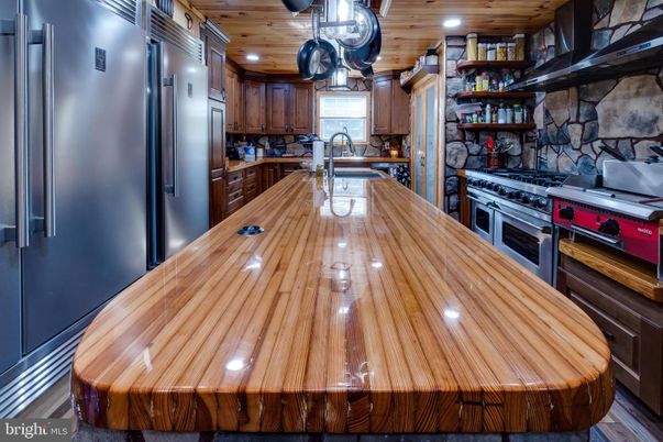 Interior, Kitchen, Recessed Lighting, Stainless Steel Appliances, Stone Walls, Wooden Ceilings