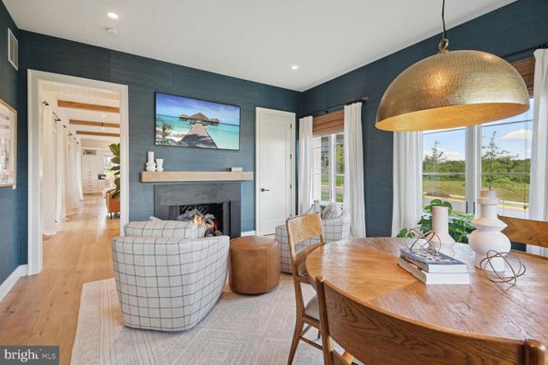 Dining room, Fireplace, Interior, Living room, Pendant Lights, Recessed Lighting, Wood Texture Flooring