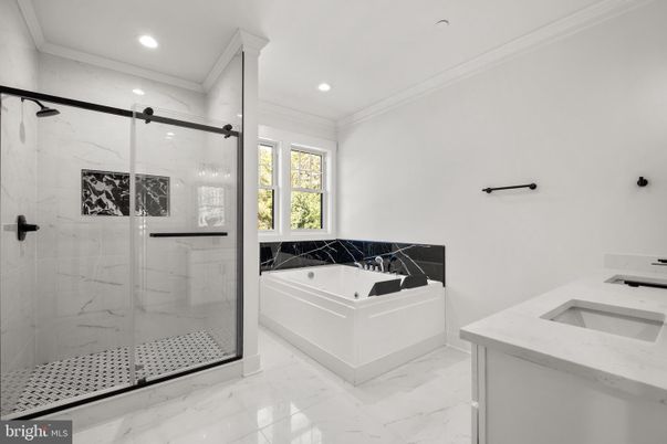 Bathroom, Dual Sink Vanities, Glass Shower, Interior, Marble, Marble Walls, Recessed Lighting