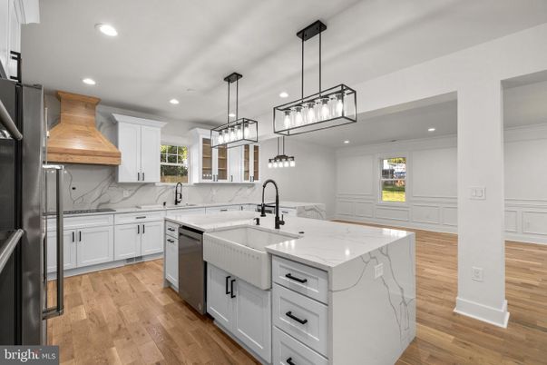 Interior, Kitchen, Marble Walls, Pendant Lights, Recessed Lighting, Stainless Steel Appliances, Wood Texture Flooring