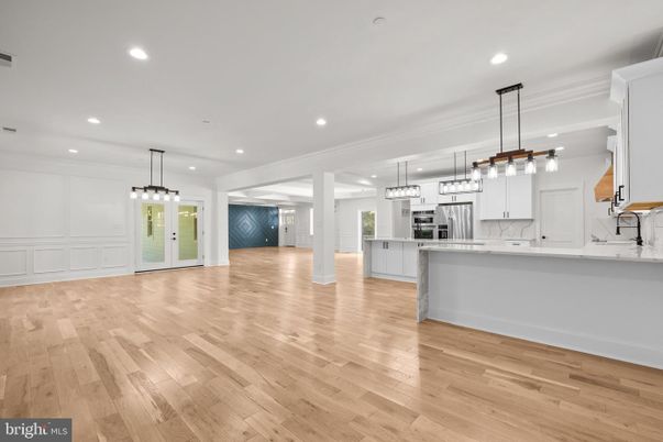 Empty room, Interior, Kitchen, Pendant Lights, Recessed Lighting, Stainless Steel Appliances, Wood Texture Flooring