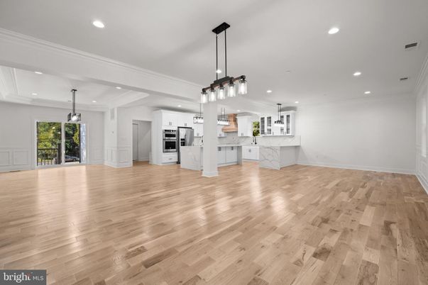 Empty room, Interior, Kitchen, Pendant Lights, Recessed Lighting, Stainless Steel Appliances, Wood Texture Flooring