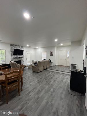 Dining room, Fireplace, Interior, Living room, Recessed Lighting, Wood Texture Flooring