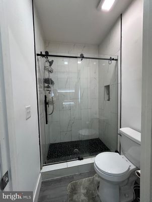 Bathroom, Glass Shower, Interior, Marble Walls, Wood Texture Flooring