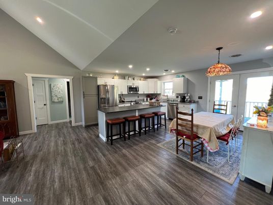 Dining room, Interior, Kitchen, Pendant Lights, Recessed Lighting, Stainless Steel Appliances, Wood Texture Flooring