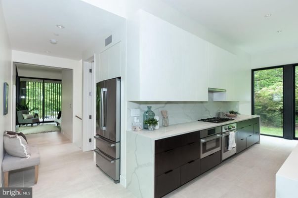 Interior, Kitchen, Marble Walls, Recessed Lighting, Stainless Steel Appliances