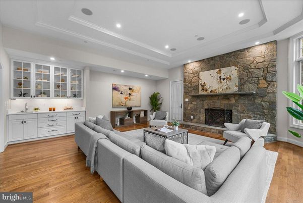 Fireplace, Interior, Living room, Recessed Lighting, Stone Walls, Wood Texture Flooring