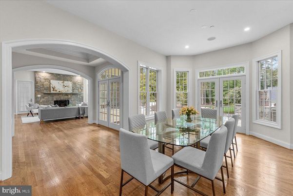 Dining room, Fireplace, Interior, Living room, Recessed Lighting, Stone Walls, Wood Texture Flooring